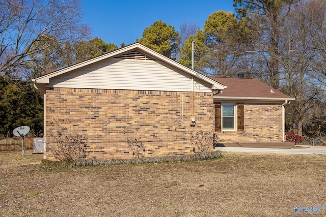 view of home's exterior featuring brick siding