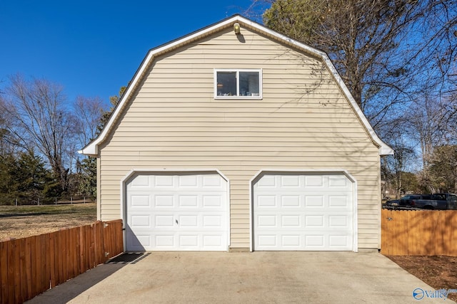 garage with fence