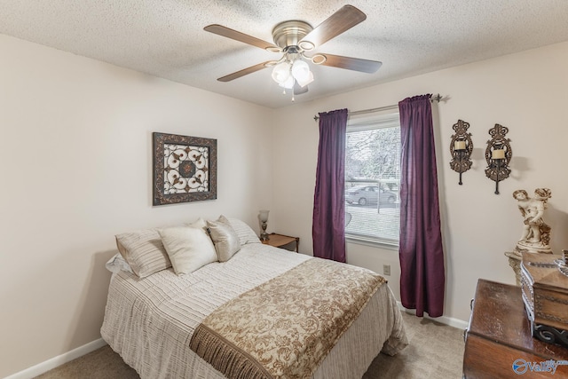 bedroom with carpet floors, ceiling fan, a textured ceiling, and baseboards