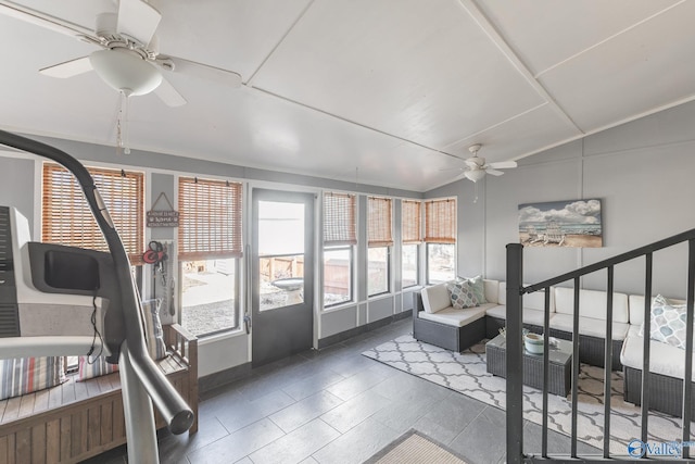 sunroom with lofted ceiling and ceiling fan