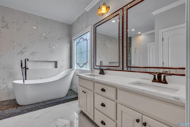 bathroom with a washtub, tile walls, vanity, and crown molding