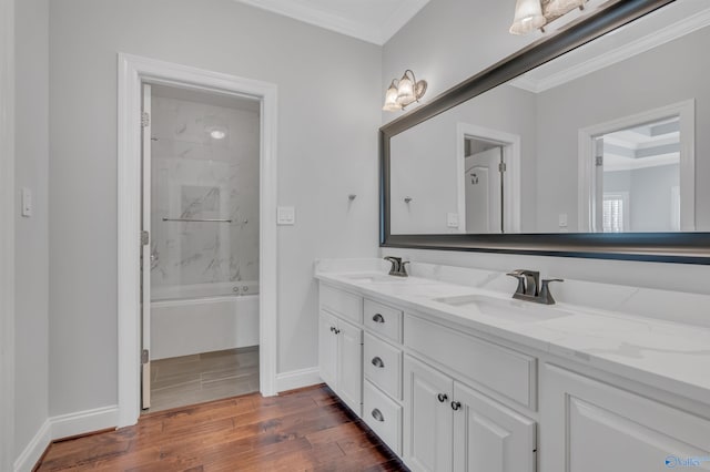 bathroom featuring shower / bathing tub combination, vanity, and ornamental molding