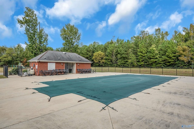 view of swimming pool with a patio area