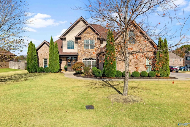 craftsman-style home with a front yard