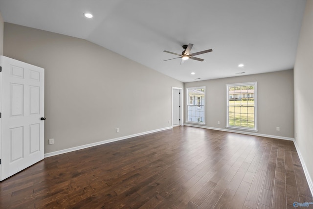 unfurnished room with vaulted ceiling, baseboards, ceiling fan, and dark wood finished floors