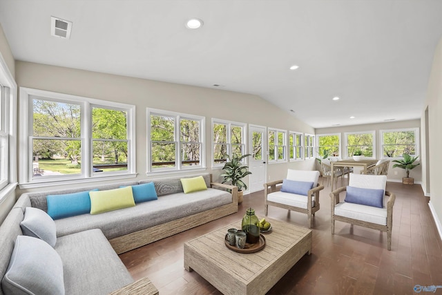 sunroom / solarium with vaulted ceiling, wood finished floors, baseboards, visible vents, and recessed lighting