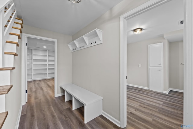 mudroom featuring dark wood-style floors, baseboards, and visible vents