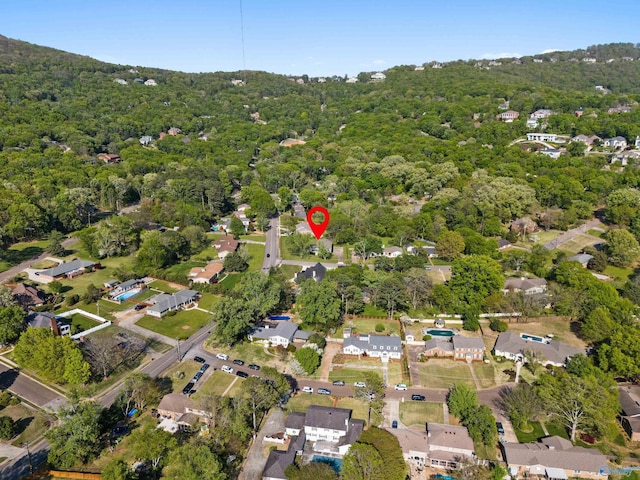 drone / aerial view with a residential view and a forest view