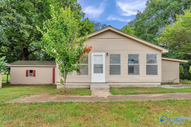 view of front of home with a front yard