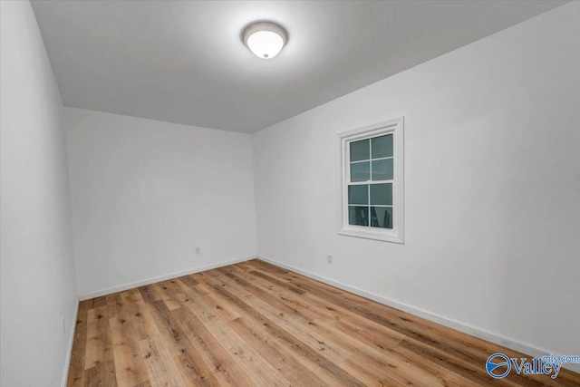 spare room with light hardwood / wood-style floors