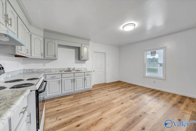 kitchen with light hardwood / wood-style floors, sink, gray cabinets, and white range with electric cooktop