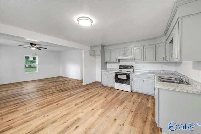 kitchen with ceiling fan, light wood-type flooring, white range with electric cooktop, gray cabinets, and sink