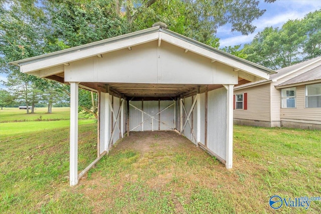 view of parking / parking lot with a yard