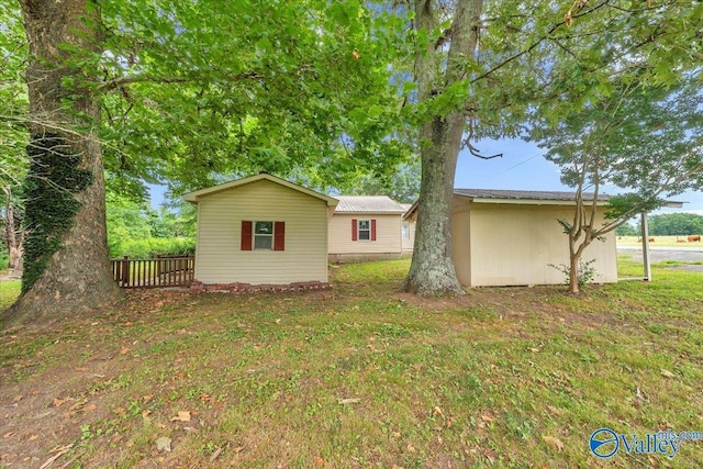 view of home's exterior with a yard