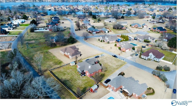 birds eye view of property with a residential view and a water view