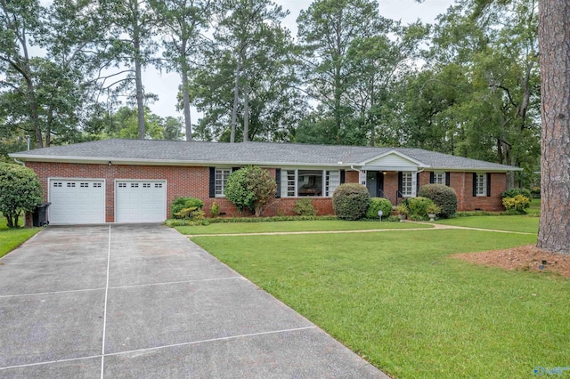 ranch-style home featuring a garage and a front yard