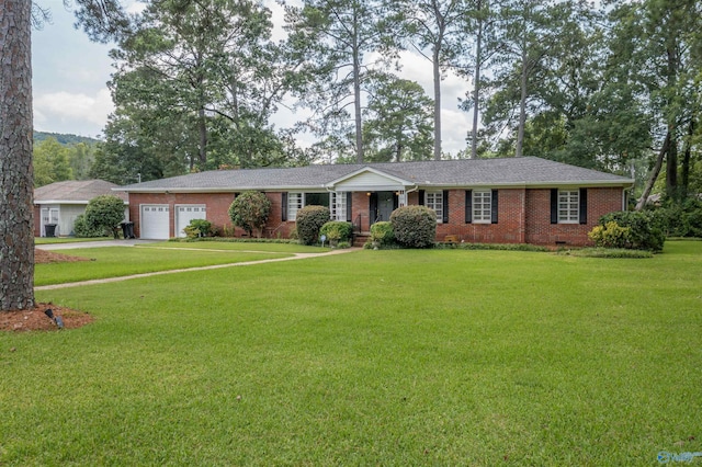 ranch-style home featuring a garage and a front yard