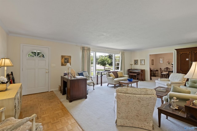 living room featuring ornamental molding, light parquet flooring, and a textured ceiling