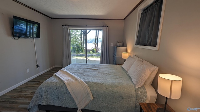 bedroom featuring crown molding, access to exterior, dark hardwood / wood-style flooring, and a textured ceiling