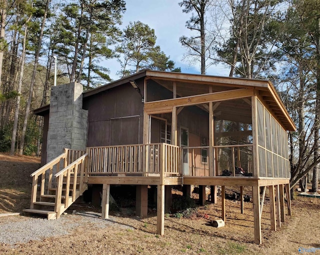 back of property featuring a sunroom