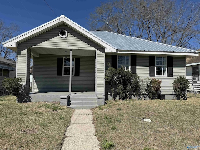 view of front of house with covered porch and a front yard