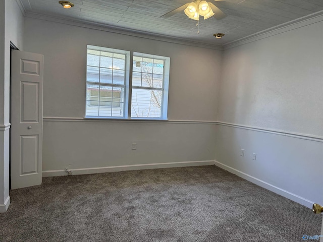 carpeted spare room with ceiling fan, wood ceiling, and ornamental molding