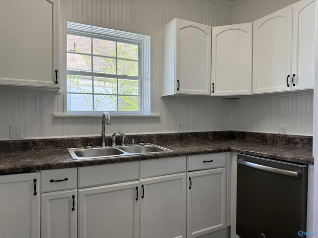 kitchen featuring sink, stainless steel dishwasher, and white cabinets