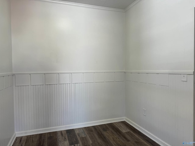 empty room with hardwood / wood-style floors and ornamental molding