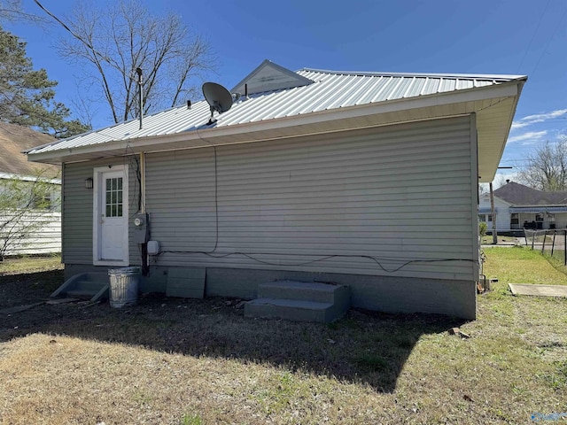 back of house with a yard