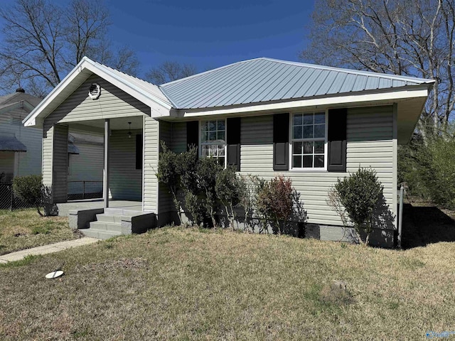 view of front of house with a front yard and a porch