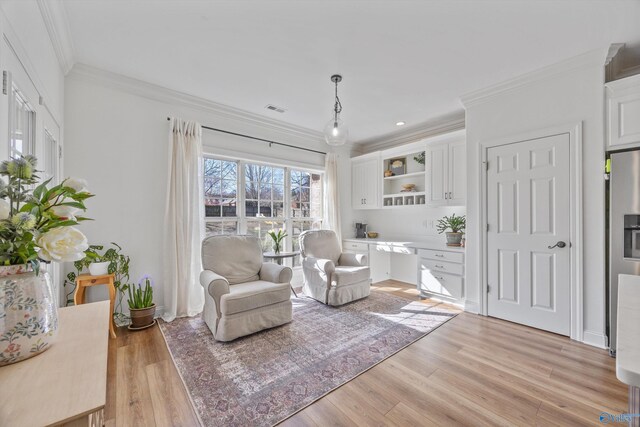 living area with recessed lighting, visible vents, crown molding, and light wood finished floors