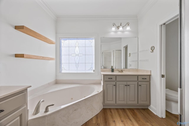 full bathroom featuring ornamental molding, a jetted tub, wood finished floors, a shower stall, and vanity