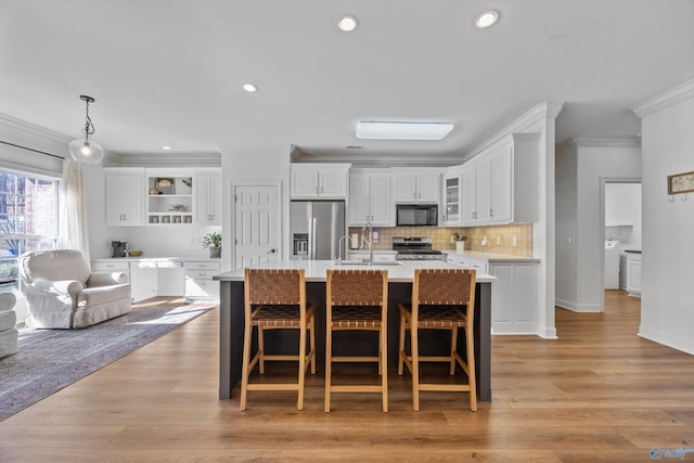 kitchen featuring open shelves, stainless steel appliances, light countertops, white cabinets, and crown molding