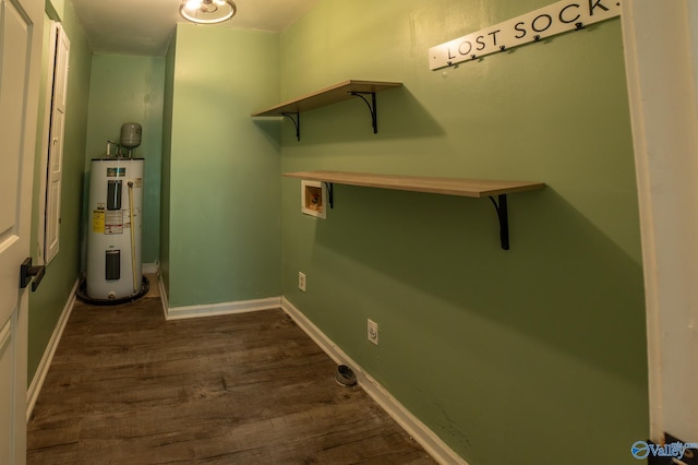 laundry room with water heater, hookup for a washing machine, and dark wood-type flooring