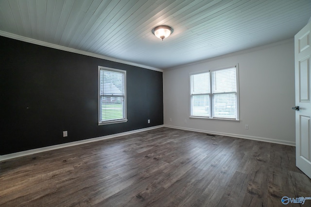 unfurnished room featuring crown molding, plenty of natural light, and dark hardwood / wood-style floors