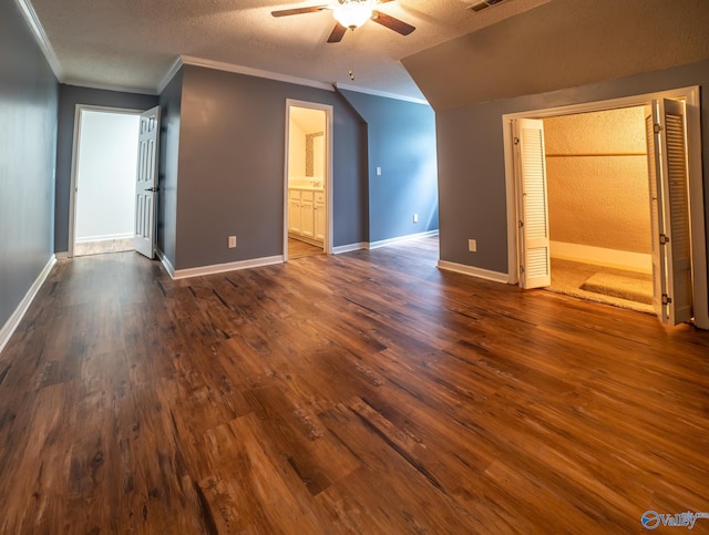 additional living space featuring ceiling fan, a textured ceiling, and dark hardwood / wood-style flooring