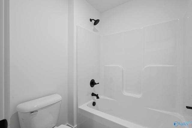 bathroom featuring  shower combination and toilet