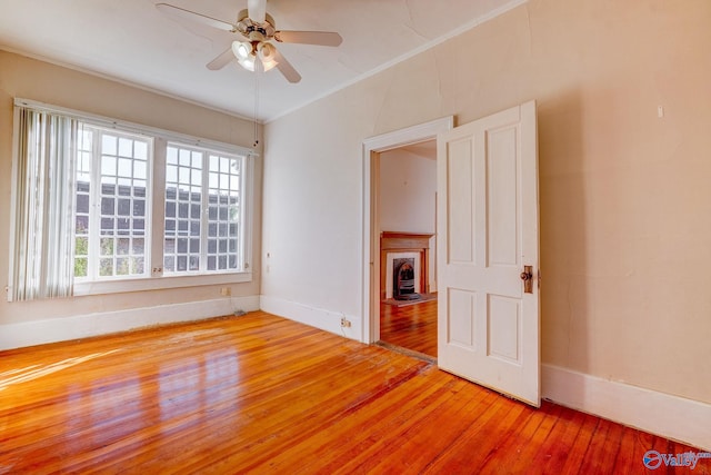 503 S Clinton St, Athens, AL 35611 - unfurnished room with light wood-style floors, ceiling fan, healthy amount of natural light, baseboards, and crown molding