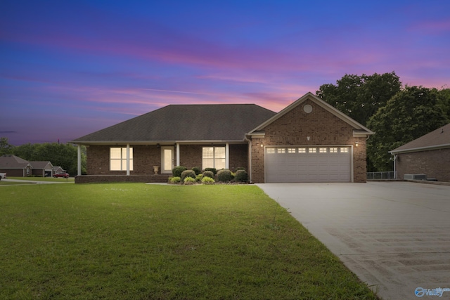 16121 Kyle Moran Dr, Athens, AL 35614 - ranch-style house featuring concrete driveway, a front yard, brick siding, and a garage