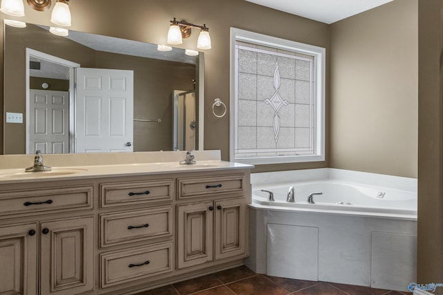 16121 Kyle Moran Dr, Athens, AL 35614 - full bath featuring double vanity, a garden tub, tile patterned floors, and a stall shower