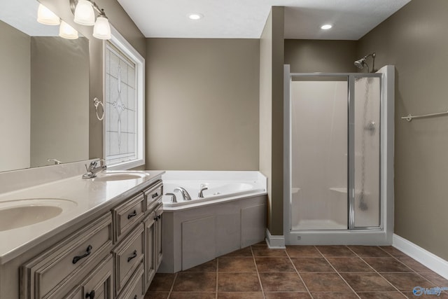 16121 Kyle Moran Dr, Athens, AL 35614 - bathroom featuring a stall shower, a garden tub, tile patterned floors, and baseboards