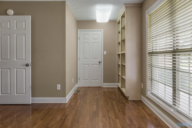 16121 Kyle Moran Dr, Athens, AL 35614 - corridor featuring dark wood-style flooring and baseboards