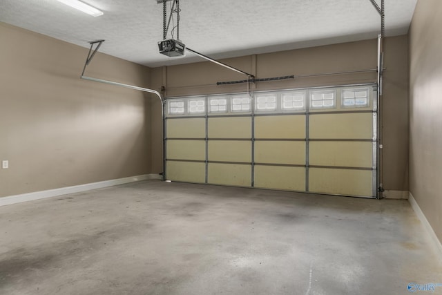 16121 Kyle Moran Dr, Athens, AL 35614 - garage featuring baseboards and a garage door opener