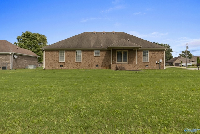 16121 Kyle Moran Dr, Athens, AL 35614 - back of property featuring a yard, roof with shingles, and brick siding