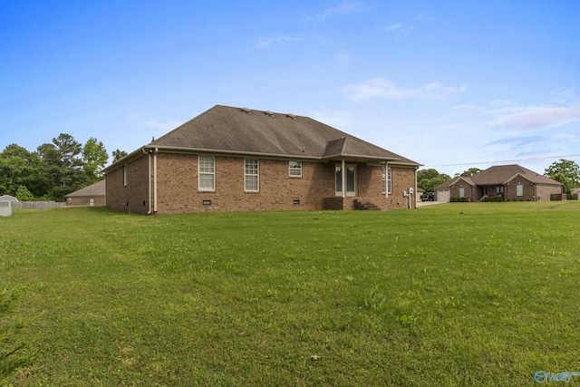 16121 Kyle Moran Dr, Athens, AL 35614 - back of house with a lawn, brick siding, and a shingled roof