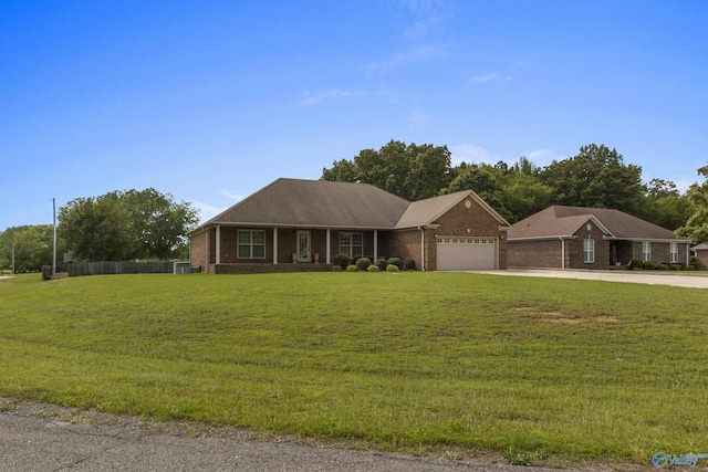 16121 Kyle Moran Dr, Athens, AL 35614 - ranch-style home featuring driveway, a garage, a front yard, and brick siding