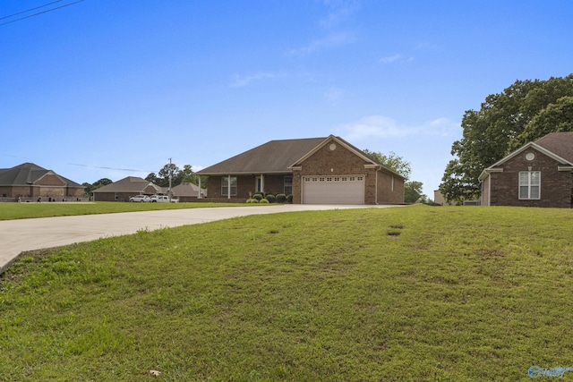 16121 Kyle Moran Dr, Athens, AL 35614 - ranch-style house with driveway, brick siding, a front lawn, and an attached garage