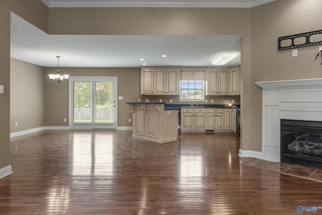 16121 Kyle Moran Dr, Athens, AL 35614 - kitchen with cream cabinets, a chandelier, dark wood finished floors, baseboards, and dark countertops