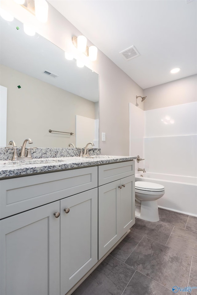 full bathroom with vanity, shower / bathtub combination, and toilet