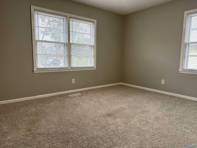 spare room with carpet flooring